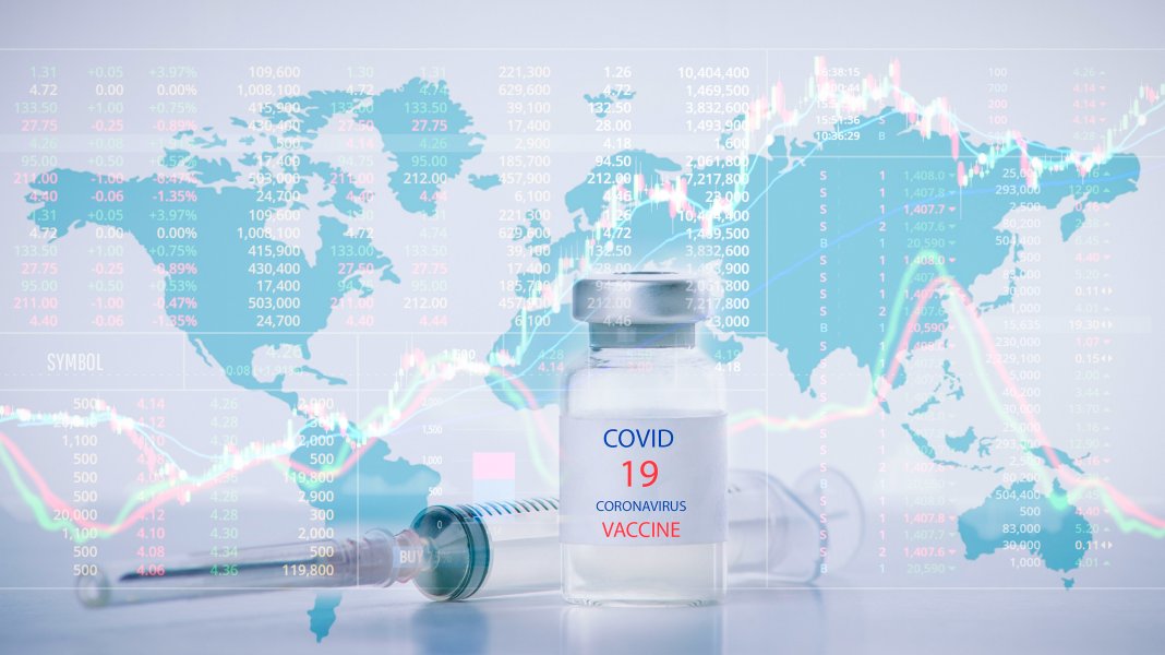 Image of a world map, with a dose/bottle of Covid-19 vaccine