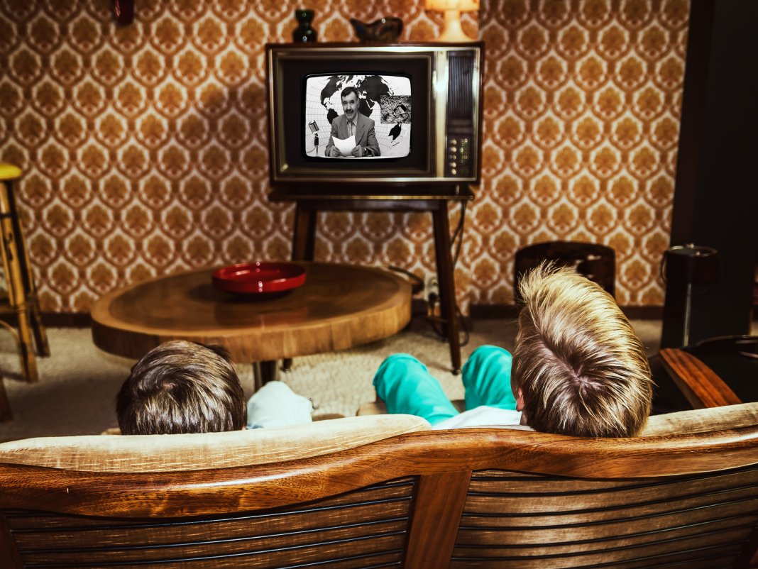 70's lounge wiht kid watching vintage TV